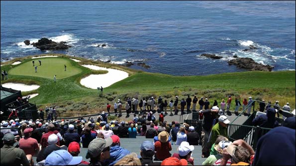 Spectators watch the action on the seventh fairway and green.jpg