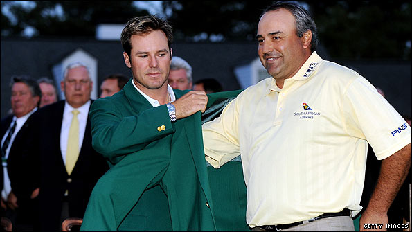Trevor Immelman helps Cabrera into his Green Jacket