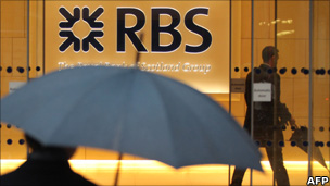 Two men are pictured in a branch of RBS