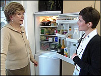Helen and Kate by a fridge freezer