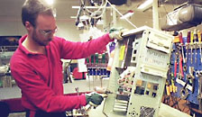 A man fixing a computer