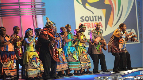 Tshepo Tshola with the Soweto Gospel Choir during the 2010 World Cup final draw in Cape Town, South Africa