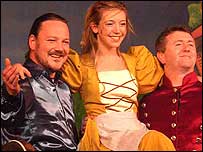 Cinders and her leading men pause for applause.