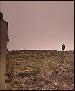 Sihouette of walker on moor