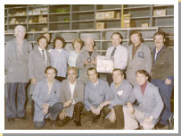 Photograph of George Cunningham presenting a retiral gift to a worker in the 1970's.