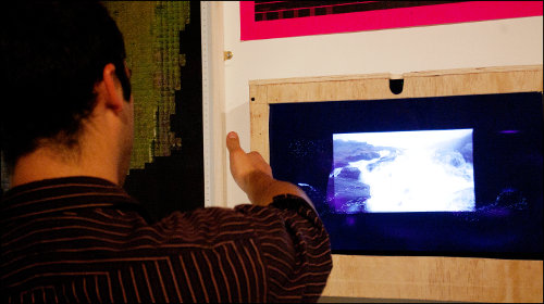 Digital images on a computer screen being calibrated to fit the installation