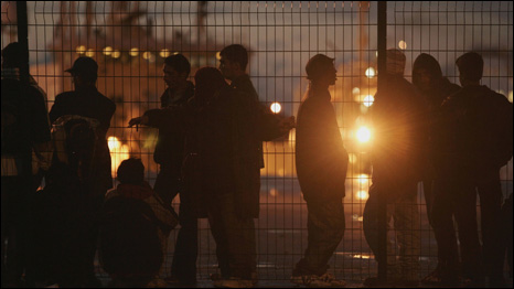 Migrants hoping to reach the UK wait at Calais.