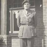 Major Desmond Bonham-Carter outside his headquarters in Hove