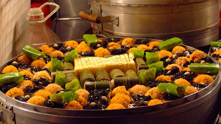 Steamed chinese veg wrapped in leaves.