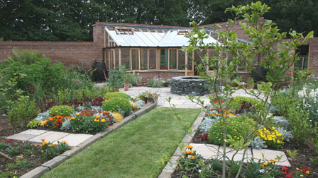 the spicy border leading up to the greenhouse at Greenacre