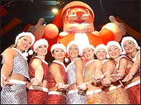The Hippodrome dancers pose with Santa.