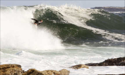 This radical wave breaks only a few metres off the jagged Sydney coastline. But local charger Paul Macklin was not to be defeated. Pic Macklin 07